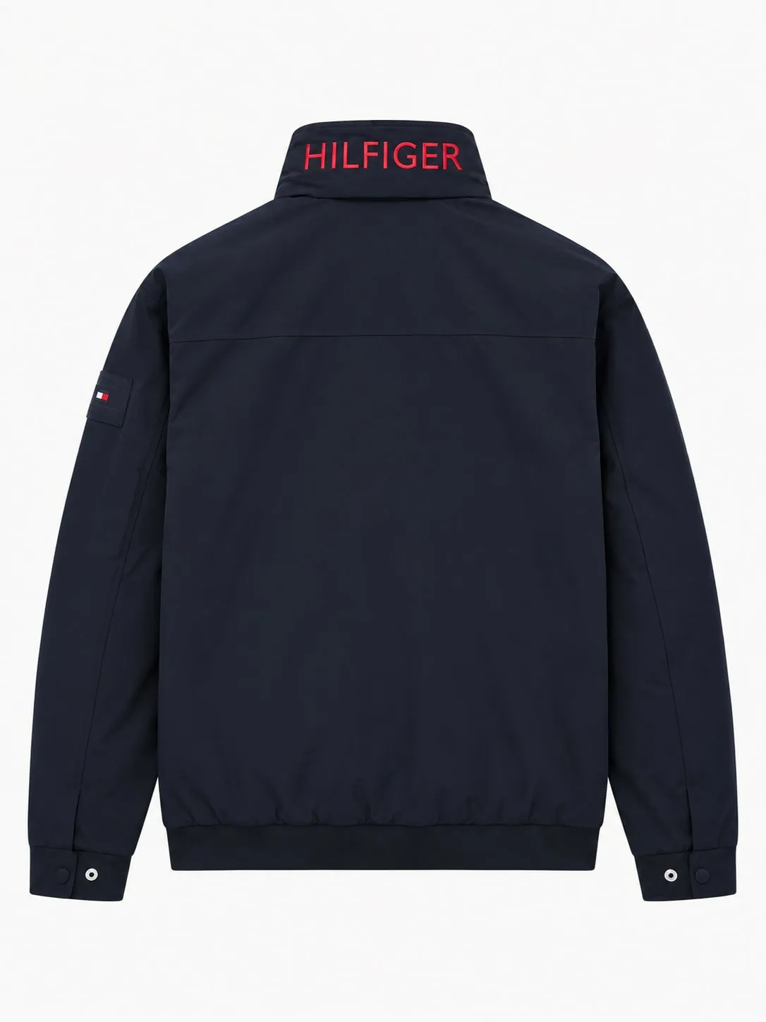 Chaqueta Tommy Hilfiger azul marino, vista de espalda con Hilfiger bordado en rojo en el cuello alto, canesú y bajo elástico